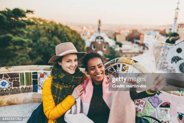 friends taking selfie at park guell,barcelona - parc güell stock pictures, royalty-free photos & images