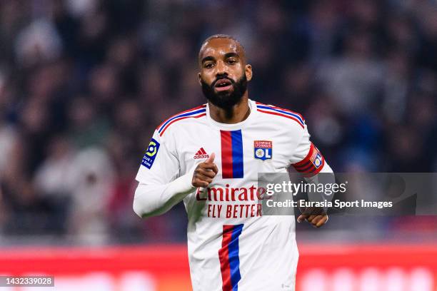 Alexandre Lacazette of Lyon runs in the field during the Ligue 1 match between Olympique Lyonnais and Paris Saint-Germain at Groupama Stadium on...