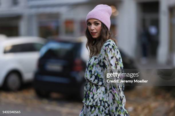 Anna Wolfers wearing a a purple knitted hat, colorful dress on October 06, 2022 in Hamburg, Germany.