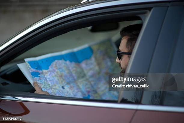 Paper Map In Car Paper Map Car Photos and Premium High Res Pictures - Getty Images