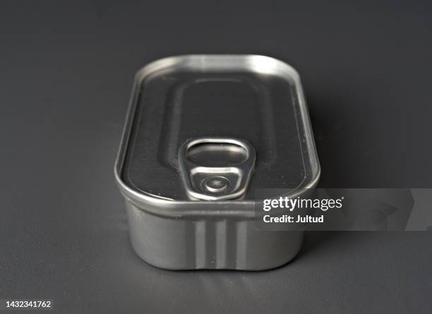 silvery tin can isolated on dark gray background - en cuisine stock pictures, royalty-free photos & images