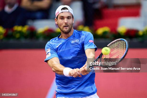 Joao Sousa of Portugal plays a backhand in his first round singles match against Dominic Thiem of Austria during day one of the Gijon Open ATP 250 at...