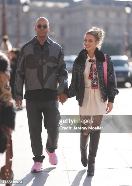 Emili Sindlev and Mads Emil Grove Moller seen wearing total Louis Vuitton looks, outside Louis Vuitton during Paris Fashion Week on October 04, 2022...