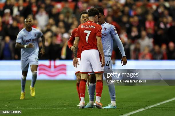 Neco Williams of Nottingham Forest clashes with Jacob Ramsey of Aston Villa during the Premier League match between Nottingham Forest and Aston Villa...