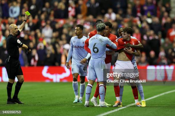 Neco Williams of Nottingham Forest clashes with Douglas Luiz of Aston Villa during the Premier League match between Nottingham Forest and Aston Villa...