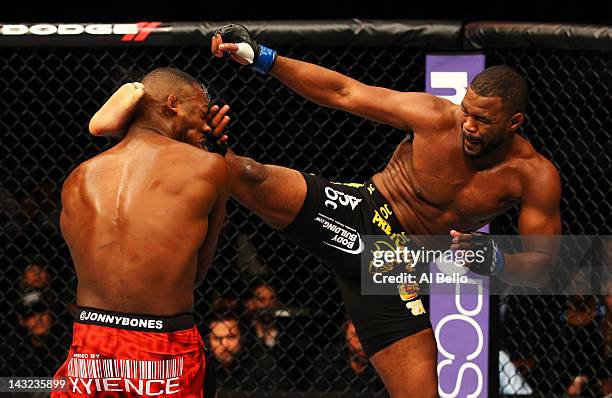 Rashad Evans kicks Jon Jones during their light heavyweight title bout for UFC 145 at Philips Arena on April 21, 2012 in Atlanta, Georgia.