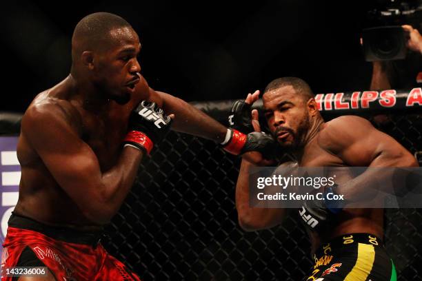 Jon Jones punches Rashad Evans during their light heavyweight title bout for UFC 145 at Philips Arena on April 21, 2012 in Atlanta, Georgia.