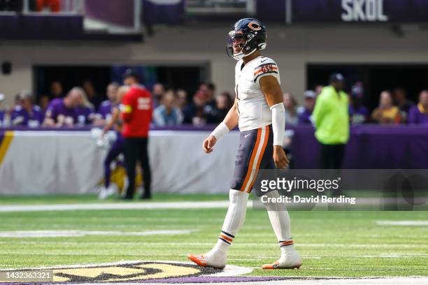 Justin Fields of the Chicago Bears looks on against the Minnesota Vikings in the third quarter of the game at U.S. Bank Stadium in Minneapolis,...