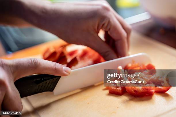 chopping red peppers on wooden cutter - food on cutting board stock pictures, royalty-free photos & images