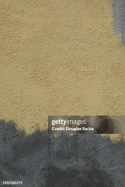 closeup of a stucco wall repair - adobe texture stock pictures, royalty-free photos & images