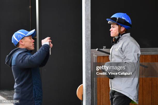 Trainer Chris Munce is seen with Craig Williams after he rode Palaisipan during a trackwork session ahead of the Caulfield Cup at Caulfield...