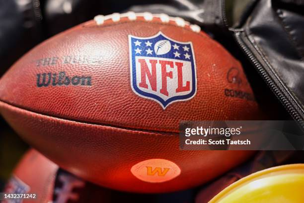 Wilson NFL football with Washington Commanders logo is seen on the sideline before the game against the Tennessee Titans at FedExField on October 9,...