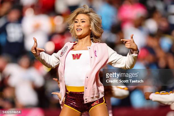 Washington Commanders cheerleader performs during the second half of the game between the Washington Commanders and the Tennessee Titans at...