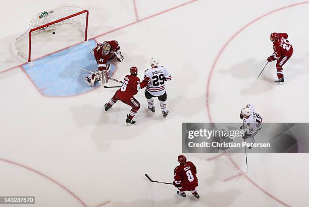 Jonathan Toews of the Chicago Blackhawks scores the game winning goal past goaltender Mike Smith of the Phoenix Coyotes in overtime of Game Five of...