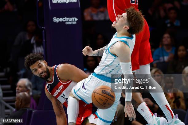 LaMelo Ball of the Charlotte Hornets reacts as he is fouled and injured during the third quarter of the game against the Washington Wizards at...