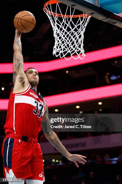 Kyle Kuzma of the Washington Wizards dunks the ball during the third quarter of the game against the Charlotte Hornets at Spectrum Center on October...