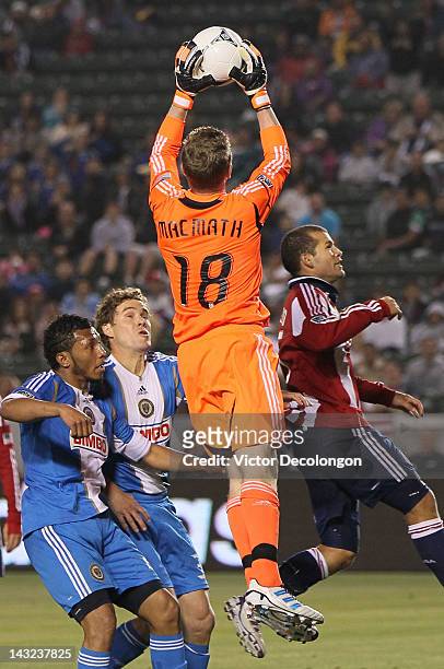 Goalkeeper Zac MacMath of Philadelphia Union makes a save in front of Alejandro Moreno of Chivas USA as teammates Chris Albright and Carlos Valdes...