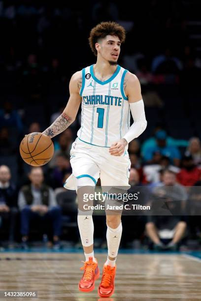LaMelo Ball of the Charlotte Hornets dribble the ball up court during the first quarter of the game against the Washington Wizards at Spectrum Center...