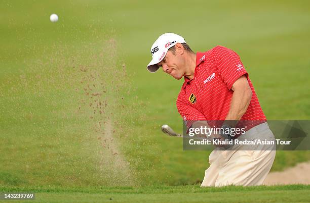 Lee Westwood of England plays a shot during day four of the CIMB Niaga Indonesian Masters presented by PNTS at Royale Jakarta Golf Course on April...
