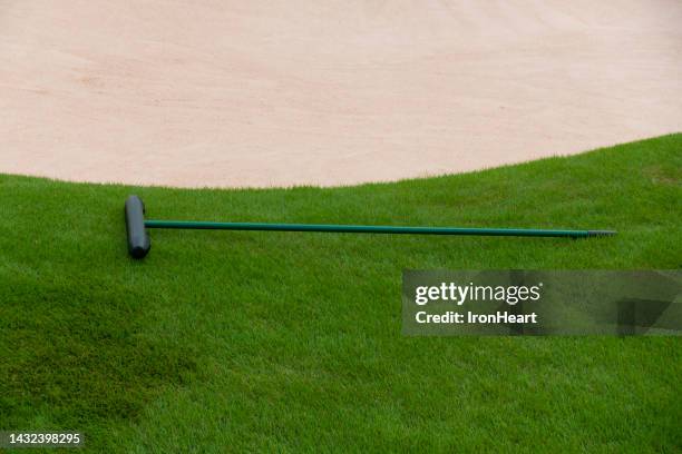 sand rake with fairway bunker. - obstáculo imagens e fotografias de stock