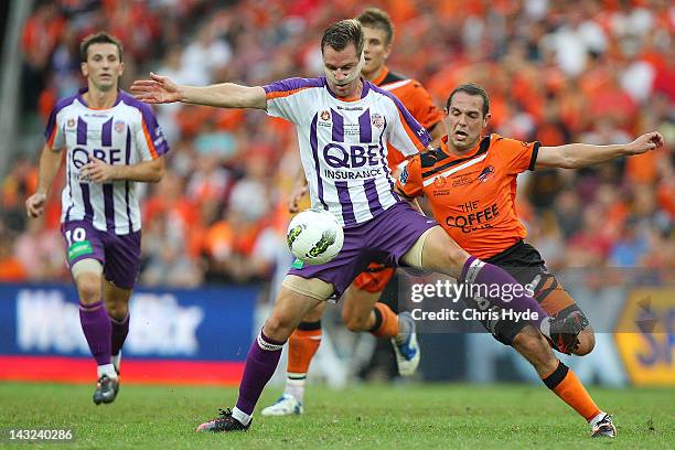 Shane Smeltz of the Glory controls the ball from Massimo Murdocca of the Roar during the 2012 A-League Grand Final match between the Brisbane Roar...