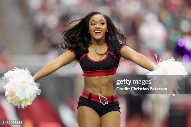 Arizona Cardinals cheerleaders perform during the NFL game at State Farm Stadium on October 09, 2022 in Glendale, Arizona. The Eagles defeated the...