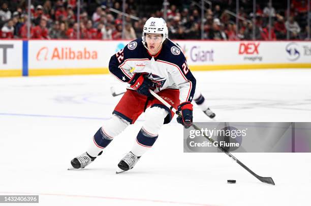 Jake Bean of the Columbus Blue Jackets handles the puck against the Washington Capitals during a preseason game at Capital One Arena on October 08,...