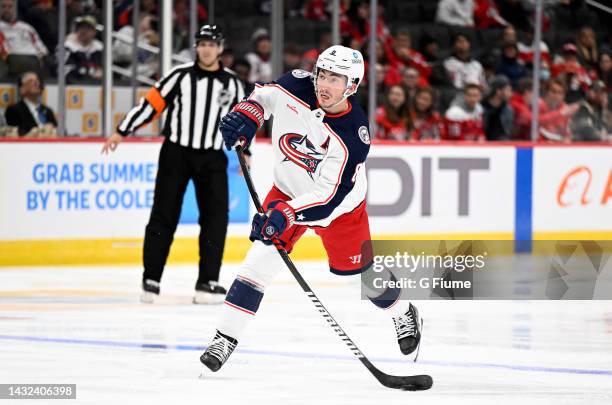 Zach Werenski of the Columbus Blue Jackets handles the puck against the Washington Capitals during a preseason game at Capital One Arena on October...