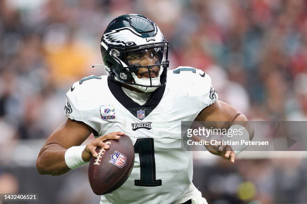 Quarterback Jalen Hurts of the Philadelphia Eagles looks to pass during the NFL game at State Farm Stadium on October 09, 2022 in Glendale, Arizona....