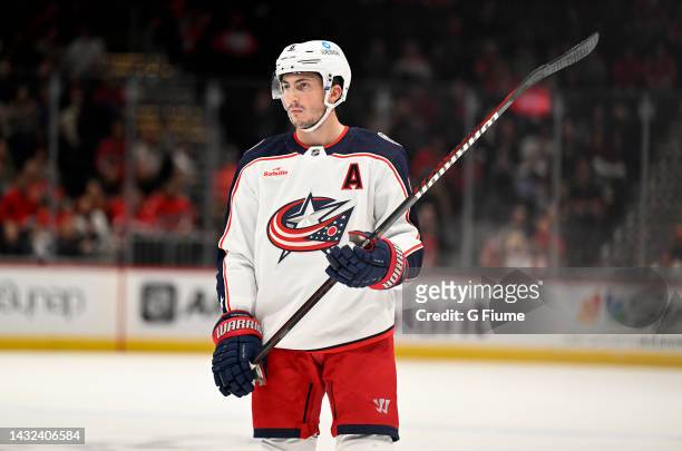 Zach Werenski of the Columbus Blue Jackets rests during a break against the Washington Capitals during a preseason game at Capital One Arena on...