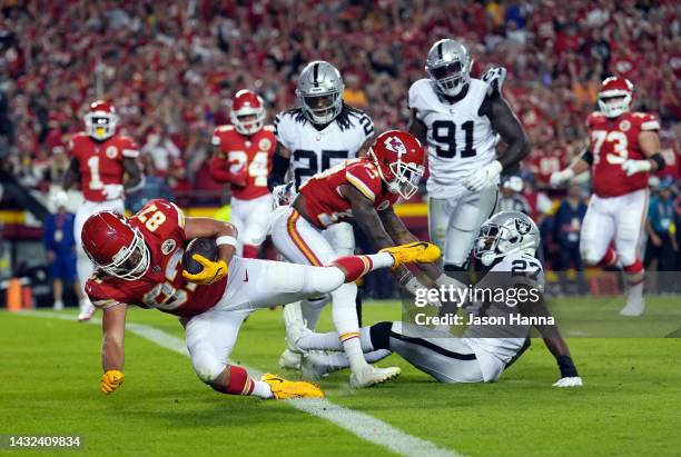 Travis Kelce of the Kansas City Chiefs cross the goal line for a touchdown during the 2nd half of the game against the Las Vegas Raiders at Arrowhead...