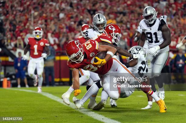 Travis Kelce of the Kansas City Chiefs crosses the goal line for a touchdown during the 2nd half of the game against the Las Vegas Raiders at...