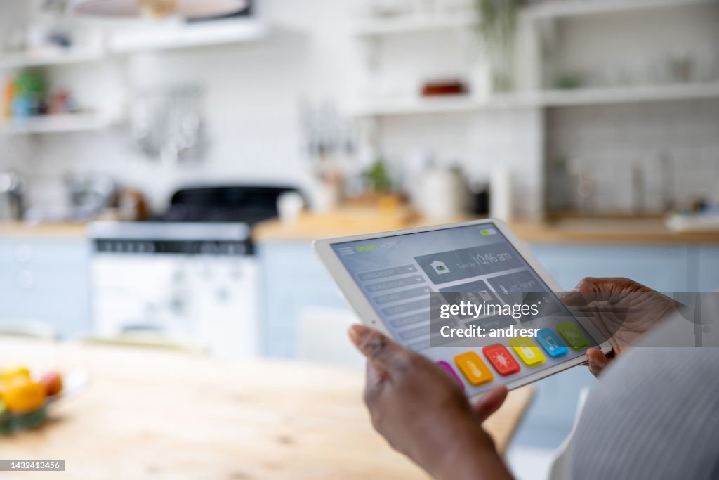 Close-up on a woman using an automated system in her smart home