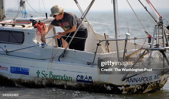 Capt. Matt Rutherford Matt Rutherford adjust the tension on the sails on his 27 foot Albin ...