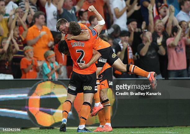 Thomas Broich, Matthew Smith and Nick Fitzgerald celebrate a goal by Besart Berisha of the Roar during the 2012 A-League Grand Final match between...
