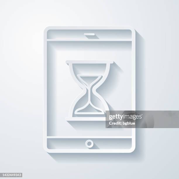 tablet pc with hourglass. icon with paper cut effect on blank background - checking time with phone stock illustrations