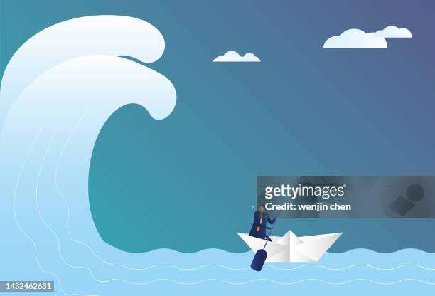 business man sailing in huge waves with paper boat, escaping from adversity - paper ship stock illustrations
