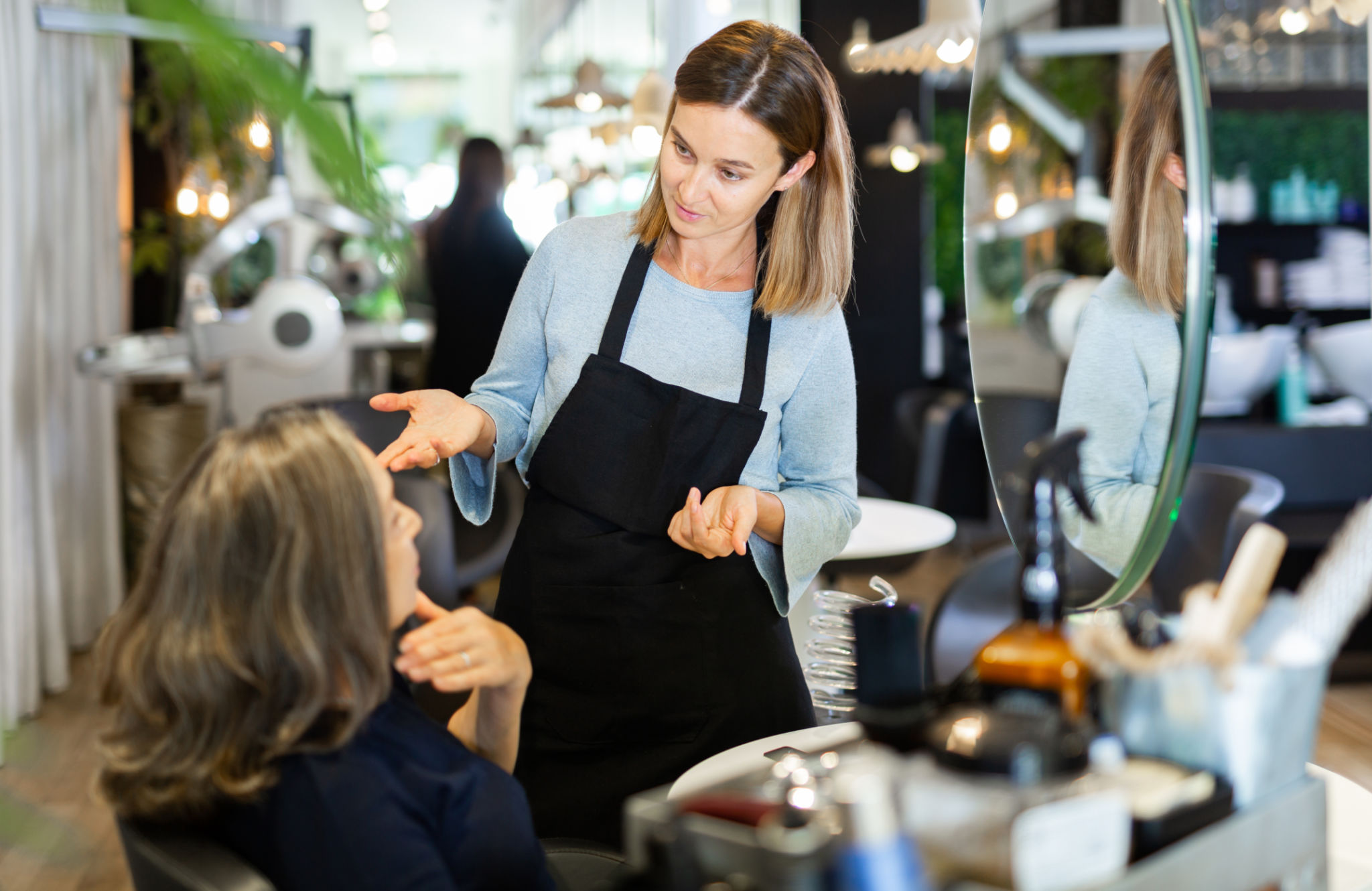 person consulting stylist