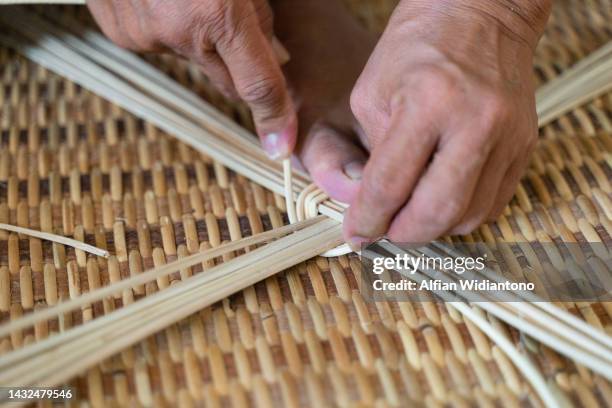 weaving rattan - wicker mat stock pictures, royalty-free photos & images