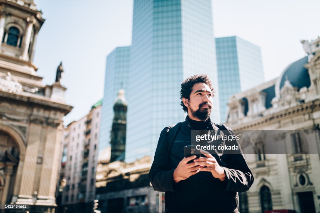 Man using cell phone at Santiago de Chile