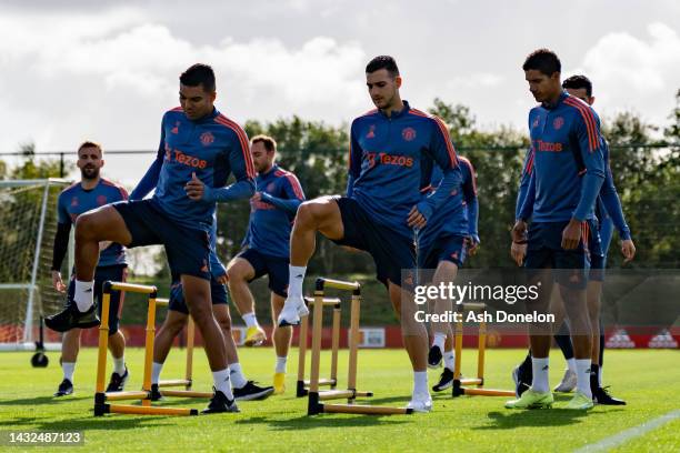 Casemiro, Diogo Dalot, Raphael Varane of Manchester United in action during a first team training session at Carrington Training Ground on October...