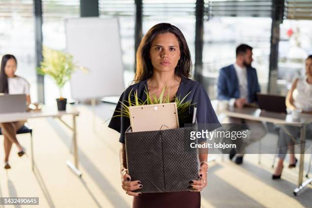 depressed businesswoman leaving the office after being fired - rejection bildbanksfoton och bilder