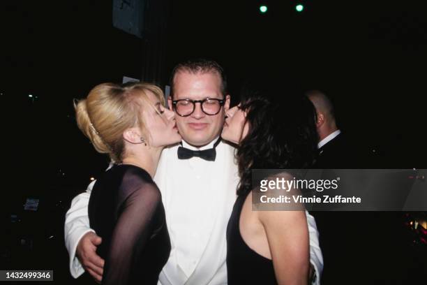 Drew Carey receives kisses from two women during 1997 Cable ACE Awards in Los Angeles, California, United States, 6th September 1997.