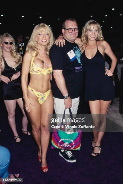 Nina Hartly, Drew Carey and Julie Ashton pose together at the Annual Video Software Dealers Association Convention and Expo, held at the Las Vegas...