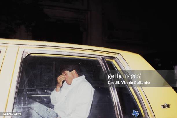 Jose Canseco takes a taxi after leaving the West Side apartment of singer Madonna, New York City, New York, United States,