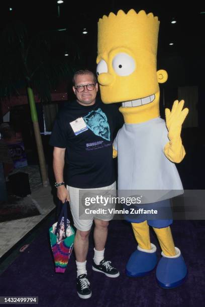 Drew Carey poses with Bart Simpson at the Annual Video Software Dealers Association Convention and Expo, held at the Las Vegas Convention Center in...
