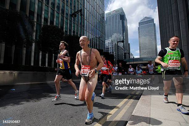 Runner wearing a mankini passes through the Canary Wharf section of the Virgin London Marathon 2012 on April 22, 2012 in London, England.