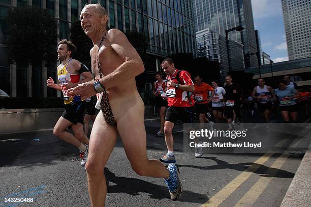 Runner wearing a mankini passes through the Canary Wharf section of the Virgin London Marathon 2012 on April 22, 2012 in London, England.