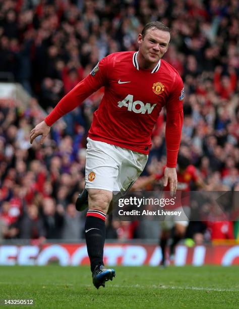 Wayne Rooney of Manchester United celebrates scoring his team's fourth goal during the Barclays Premier League match between Manchester United and...