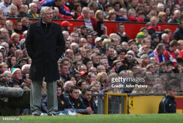Manager Sir Alex Ferguson of Manchester United watches from the touchline during the Barclays Premier League match between Manchester United and...